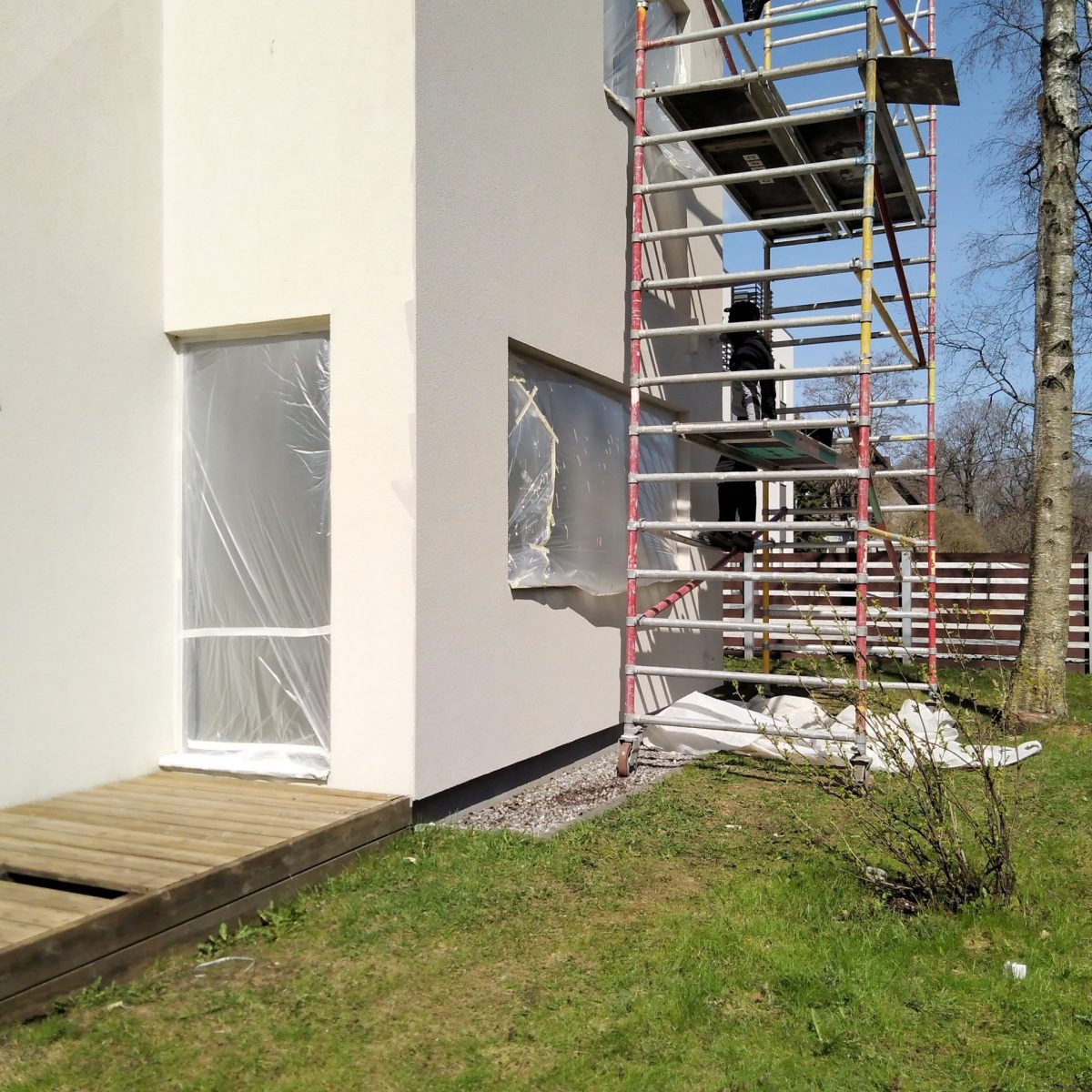 Facade renovation, washing and painting walls, cleaning washing wall house pressure water facade exterior
